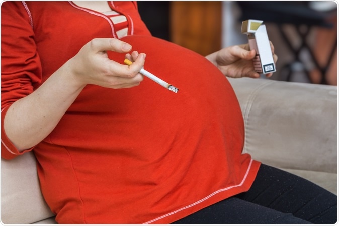 Drinking or smoking while breastfeeding and affects later cognition in children. Image Credit: By vchal / Shutterstock