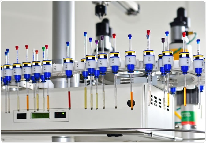 Autosampler of NMR spectrometer loaded with samples for analysis. Image Credit: Smereka / Shutterstock