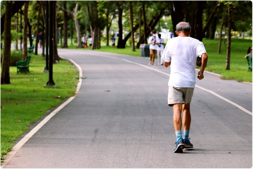 Old man doing HITT exercise in the park.