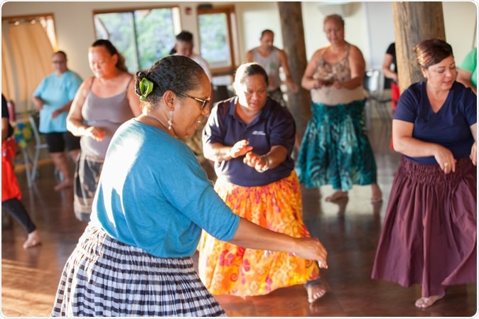 Hula instructor leading class, Kumu hula (Hula teacher) Kamanaʻo Manoa-Hyde leading her class. Waiʻanae Coast Comprehensive Health Center. Copyright Nicasello Photography