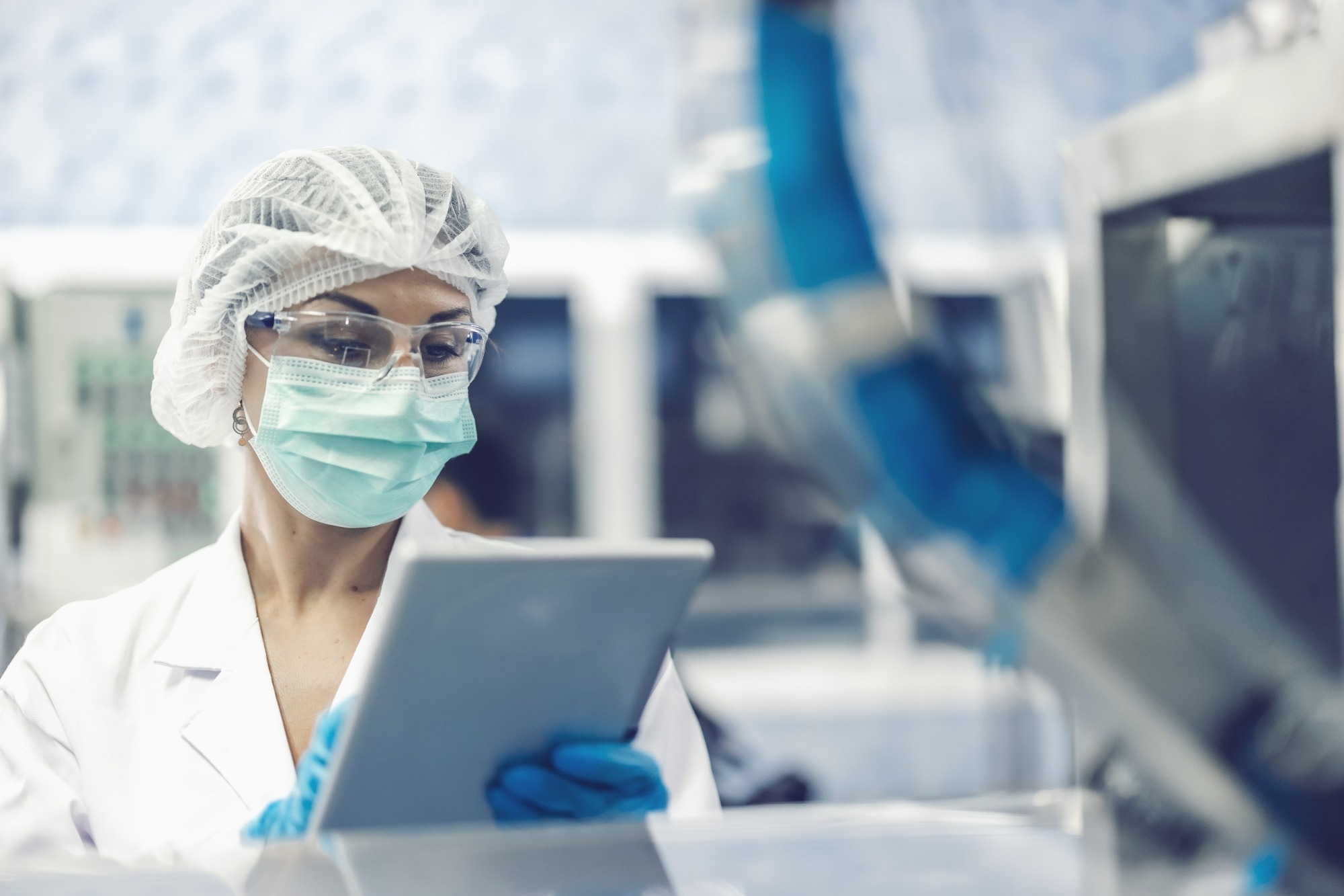 Hygiene women worker work in science laboratory. people in pharmaceutical medicine production machine inspector.