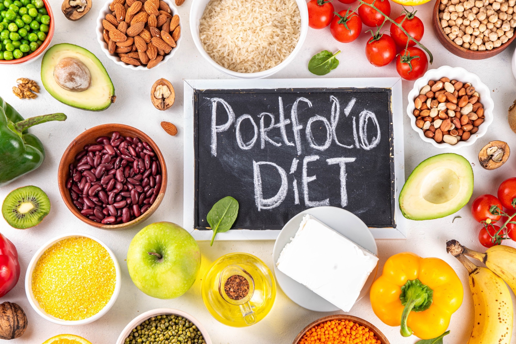Portfolio diet including nuts, vegetable protein, plant sterols, viscous fiber, beans, legumes, fresh vegetables and fruits on white background