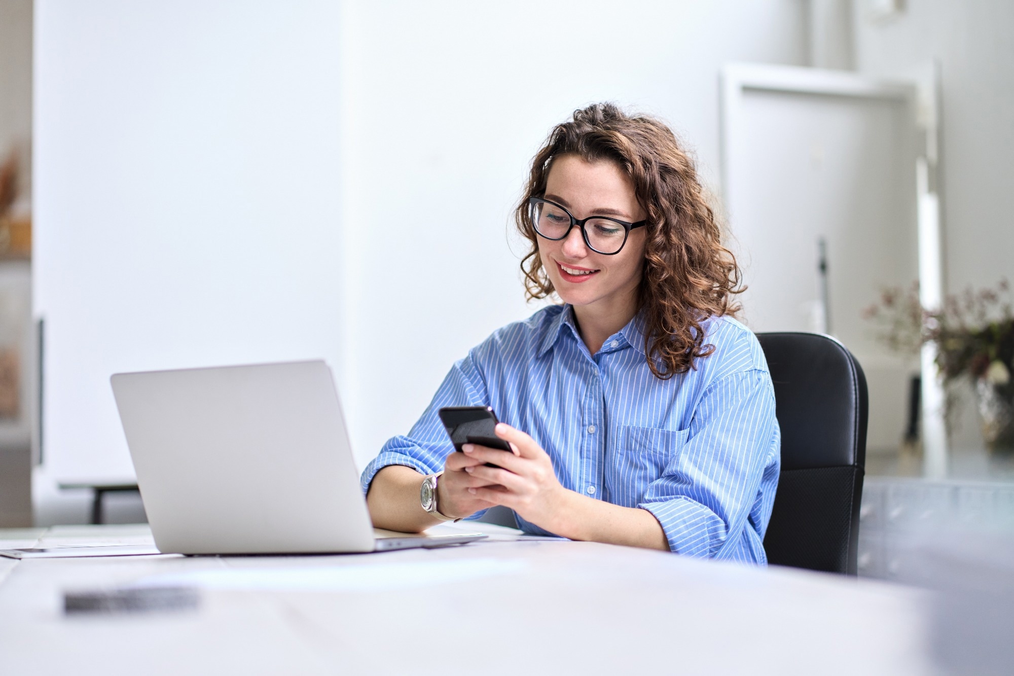 Professional businesswoman worker looking at smartphone